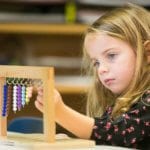 Little girl learning at the STEM program at Children's Magnet Montessori school.
