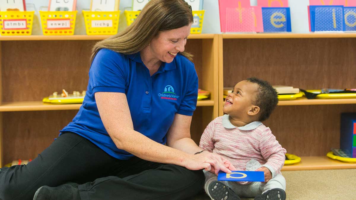 Teacher with child at toddler programs.