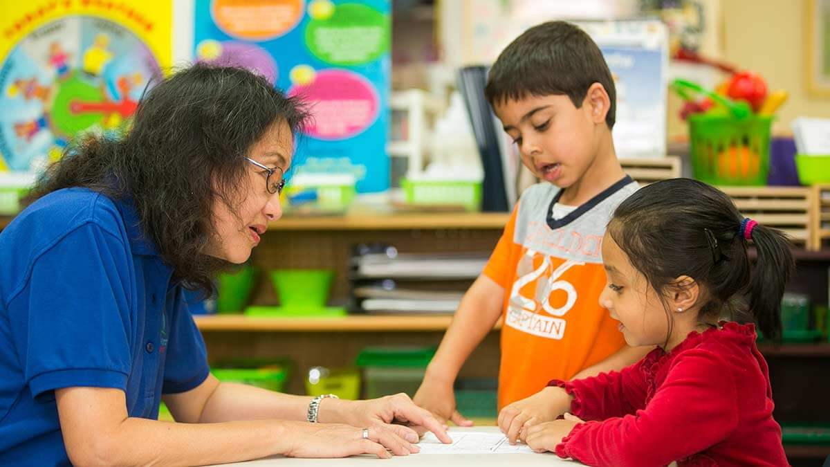 Teacher with students at preschool in Maryland.