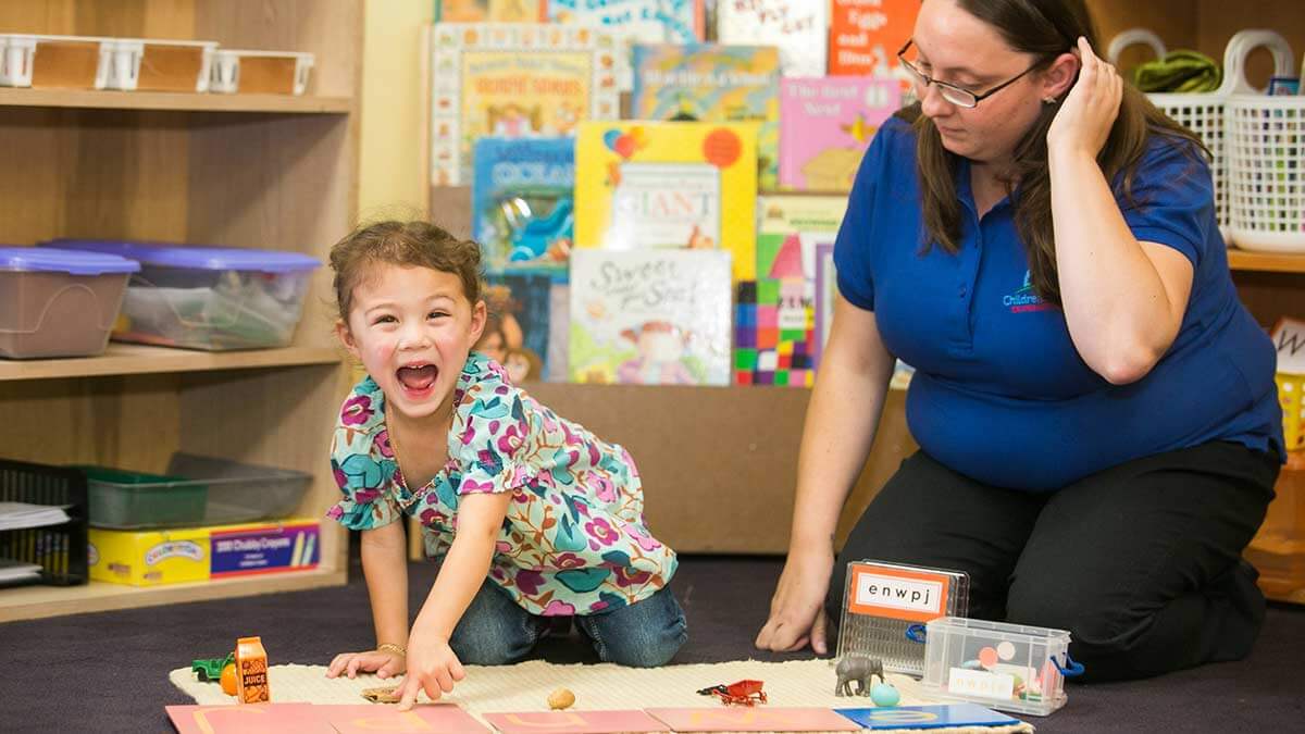 Teacher with students at preschool in Maryland.