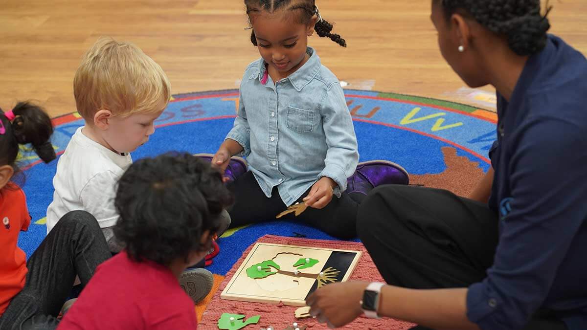 Teacher with students at preschool in Maryland.