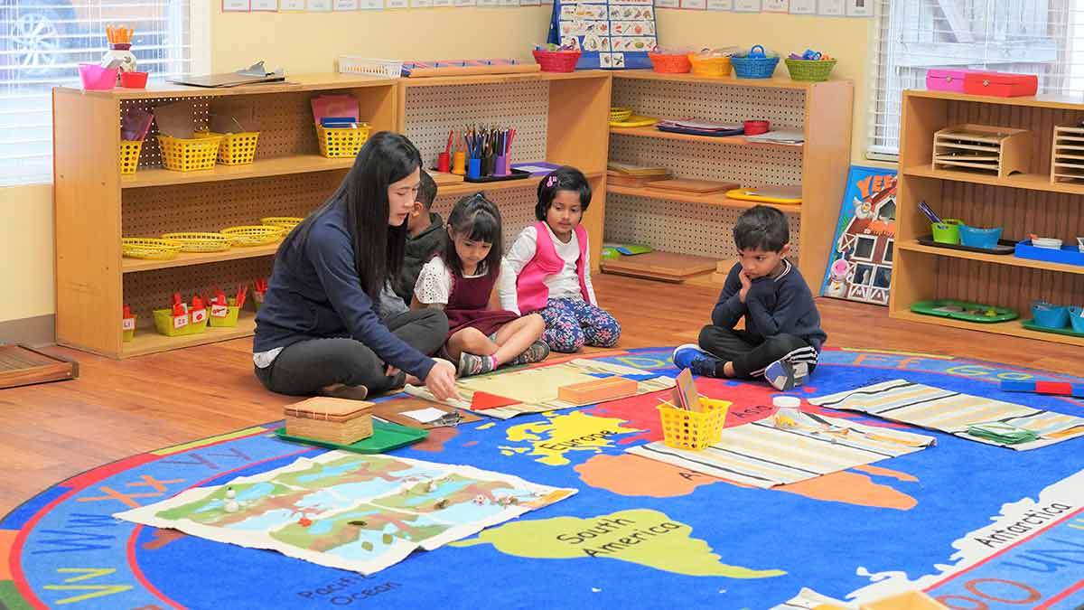 Children learning at the primary Montessori programs.