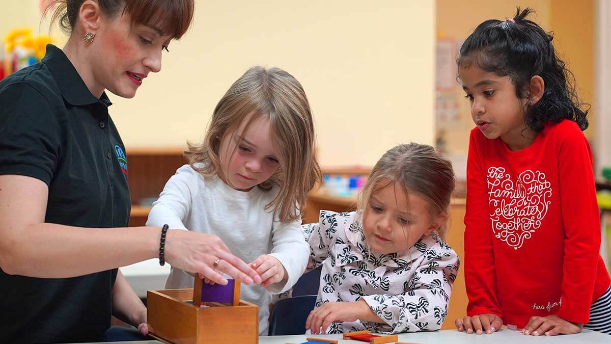 Children learning at the primary Montessori programs.