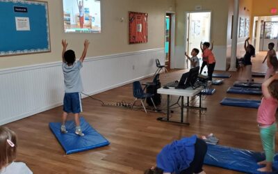 children practicing yoga